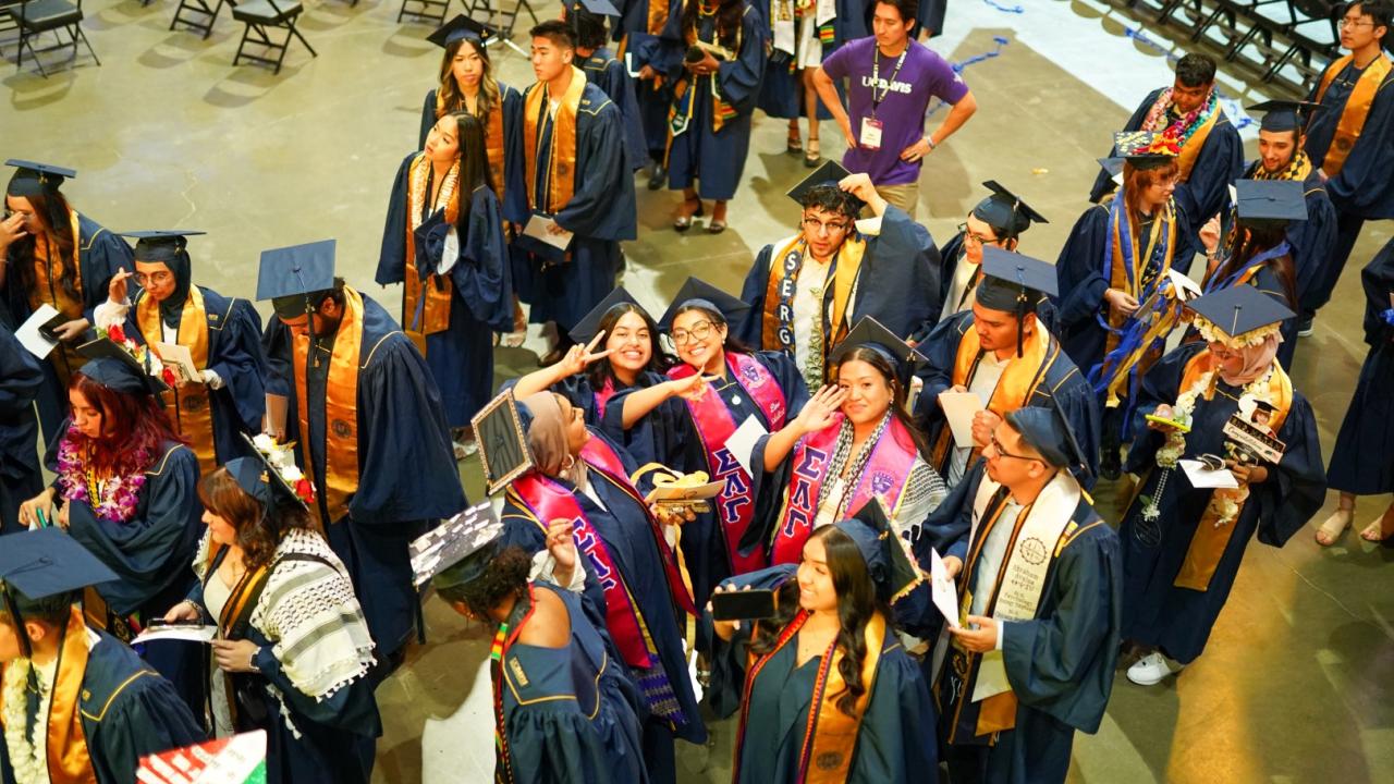 Graduates enter the Golden 1 Center